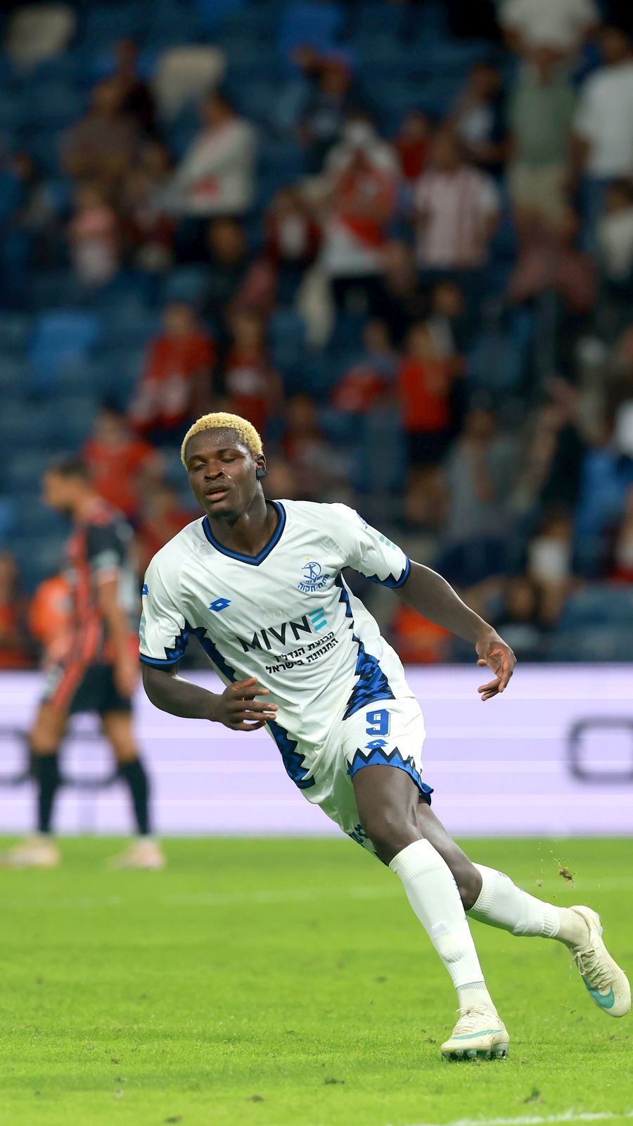 Yves Erick Bile (#9, Hapoel Petah Tikva) is running with the ball