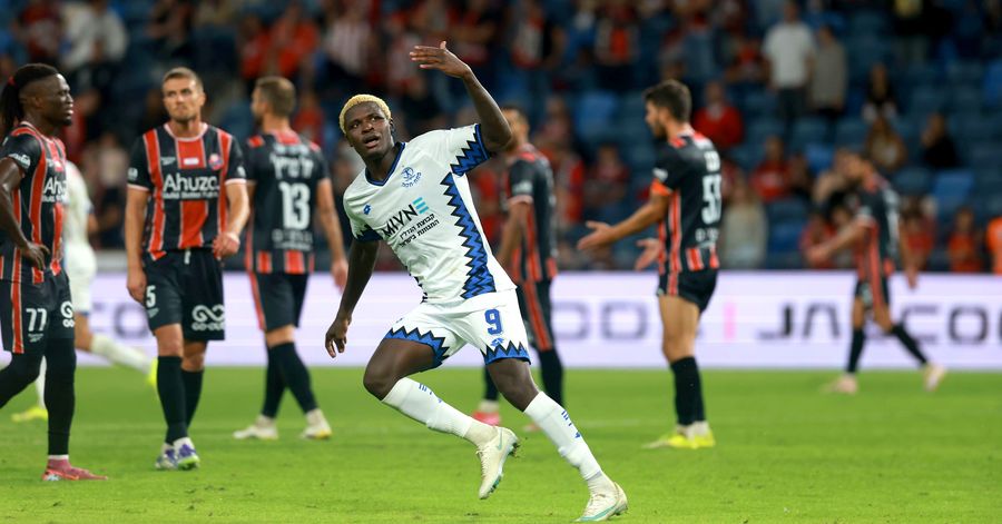 Yves Erick Bile (Hapoel Petah Tikva) celebrates with his right arm raised