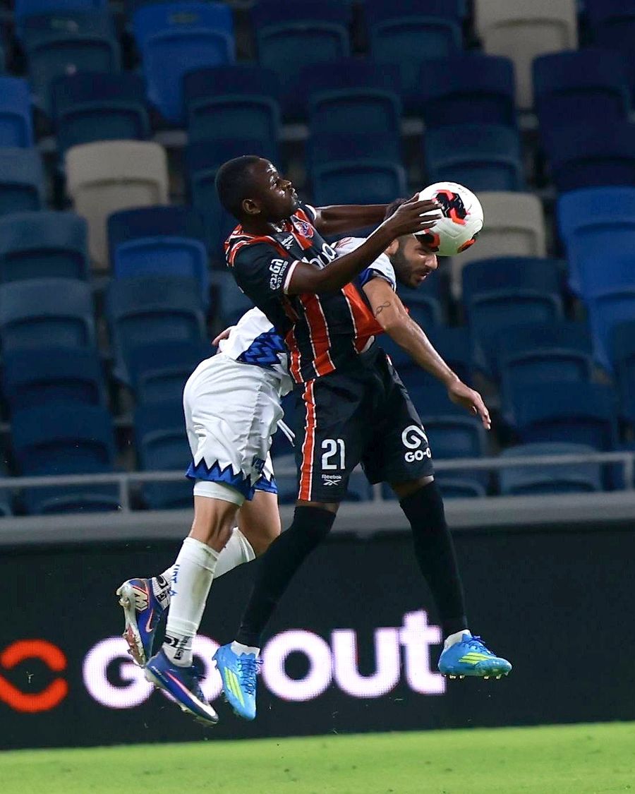 Cheickna Diakité (#21, Hapoel Haifa) competes for an aerial ball