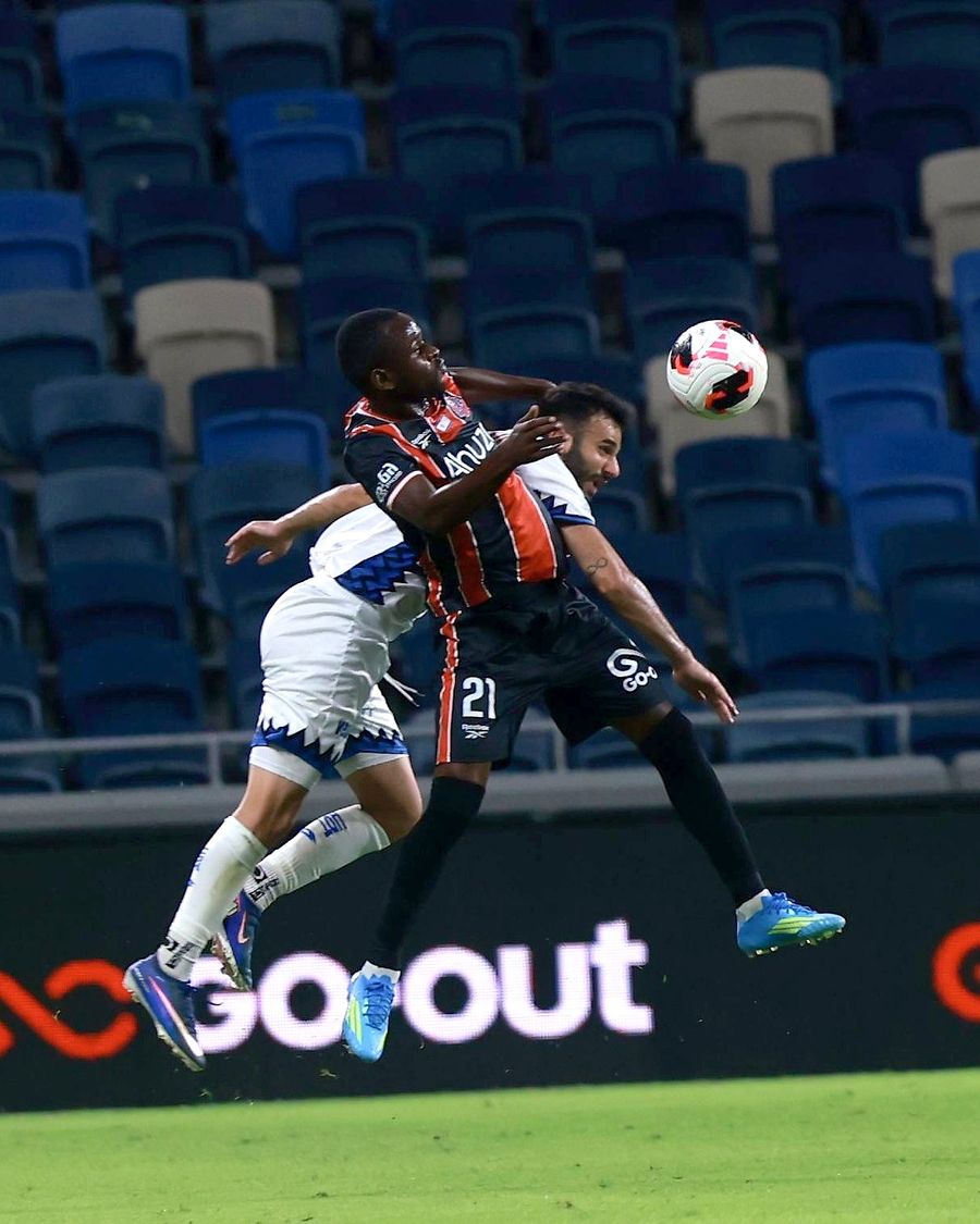 Cheickna Diakité (#21, Hapoel Haifa) competes for an aerial ball