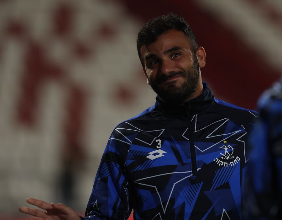 Harel Shalom (#3, Hapoel Petah Tikva) is standing and looking towards the camera