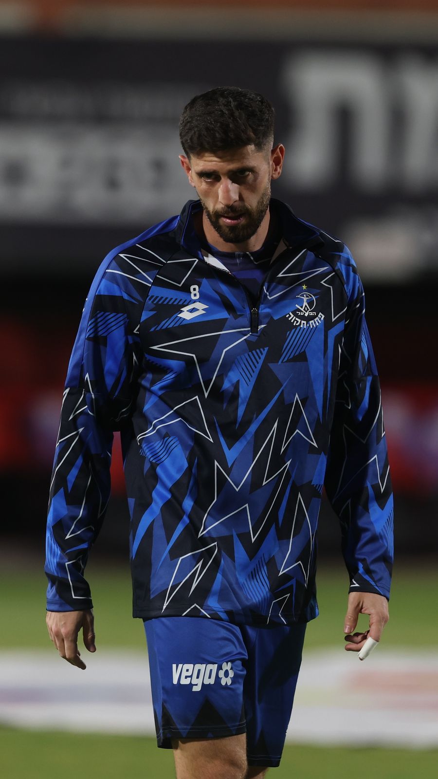 Tomer Altman (#8, Hapoel Petah Tikva) is walking on the field