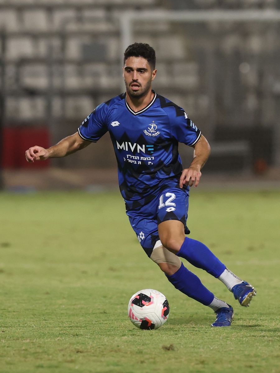 Stav Israeli (#12, Hapoel Petah Tikva) strikes the ball with his right foot