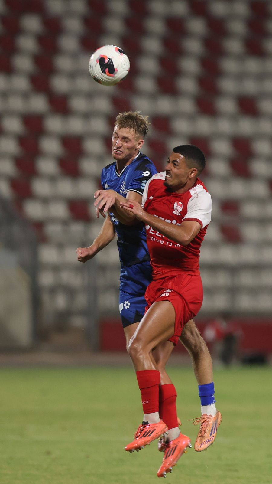 Ilay Hajaj (Bnei Sakhnin) competes for an aerial ball