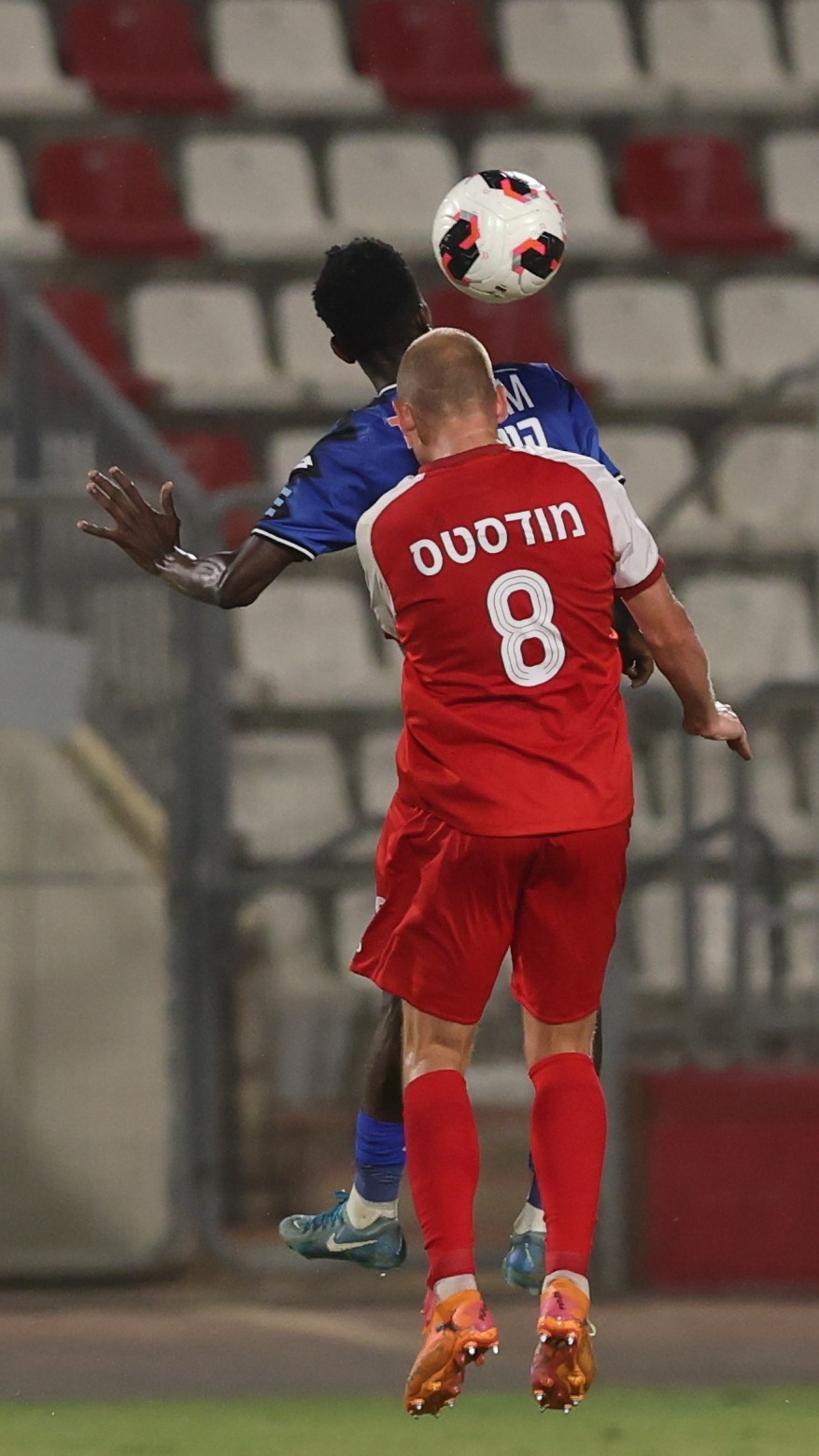 A Bnei Sakhnin player competes for an aerial ball