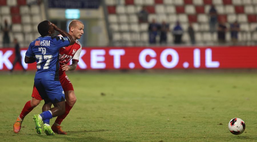 Modestas Vorobjovas (Bnei Sakhnin) defends against an opponent