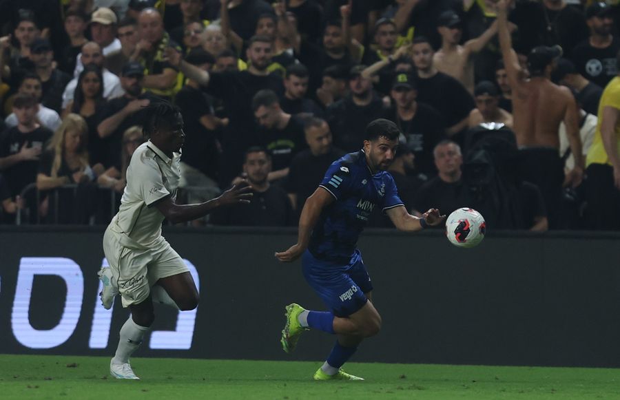 Roy Levy (Hapoel Petah Tikva) strikes the ball from outside the box