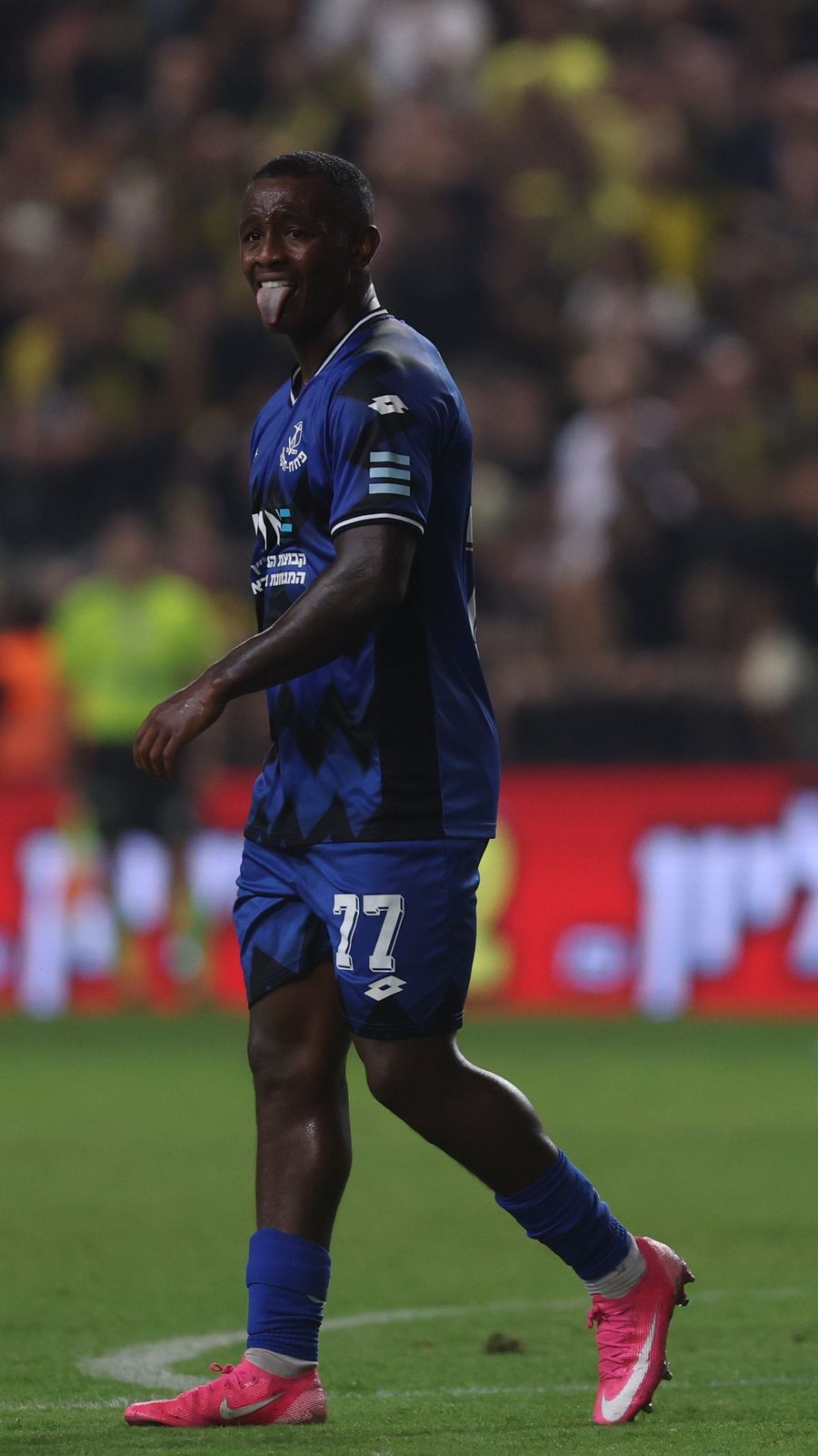 Clé (#77, Hapoel Petah Tikva) walks with his tongue out