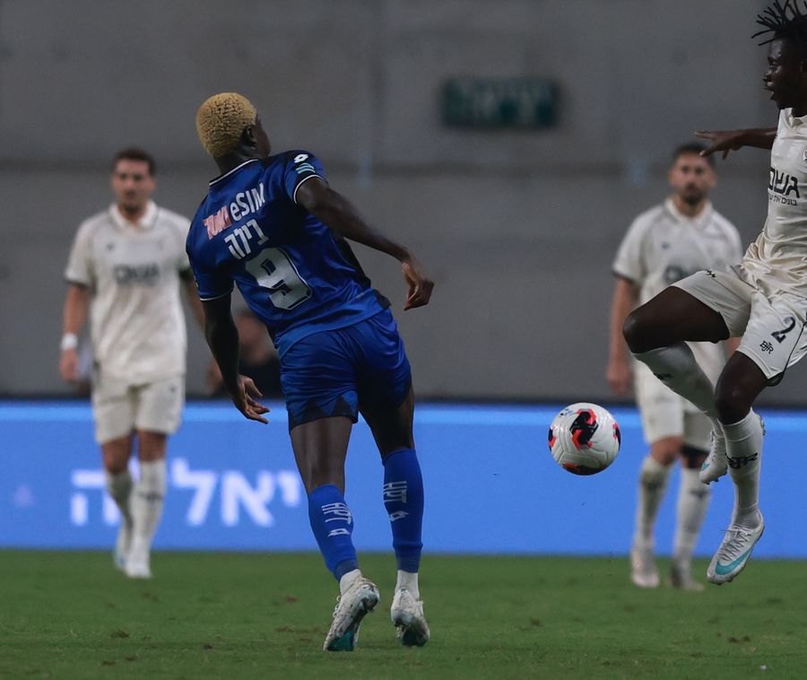 A footballer about to kick the ball