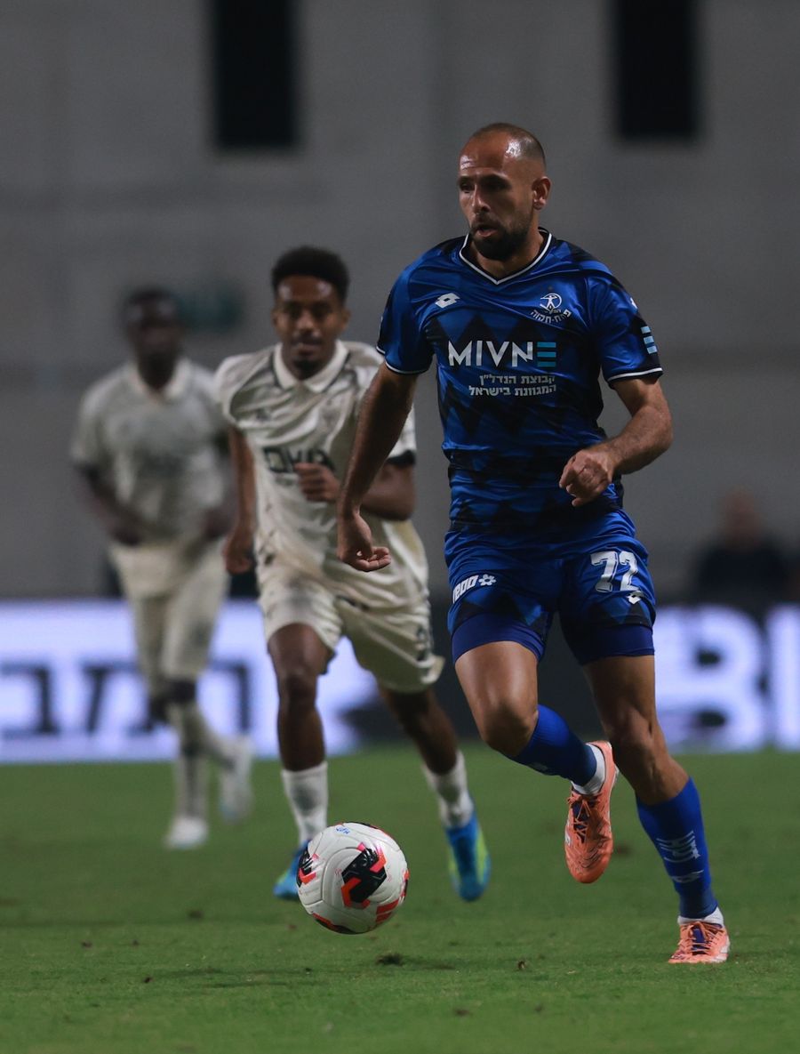 Daniel Worko (Beitar Jerusalem) strikes the ball from outside the box