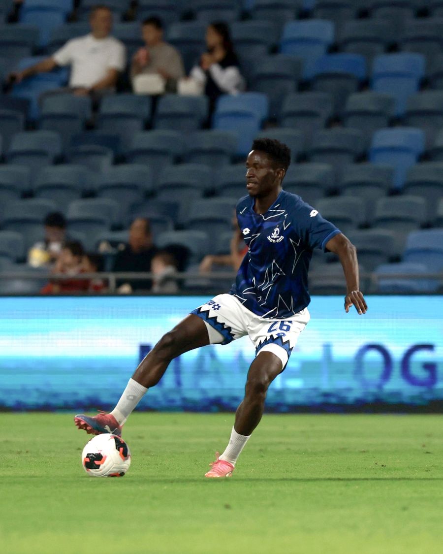 Karim Kimvuidi (#26, Hapoel Petah Tikva) strikes the ball with his right foot