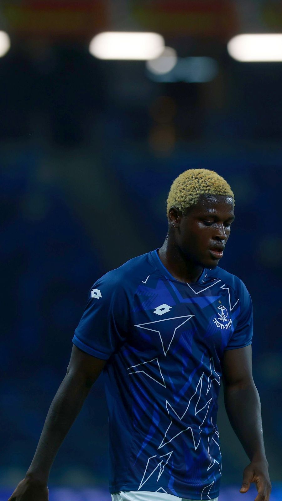 Yves Erick Bile (Hapoel Petah Tikva) walks towards the camera