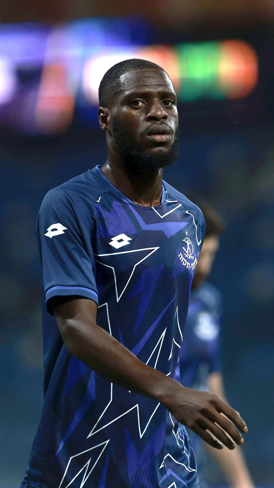 Alex Moussounda (Hapoel Petah Tikva) is standing and looking ahead