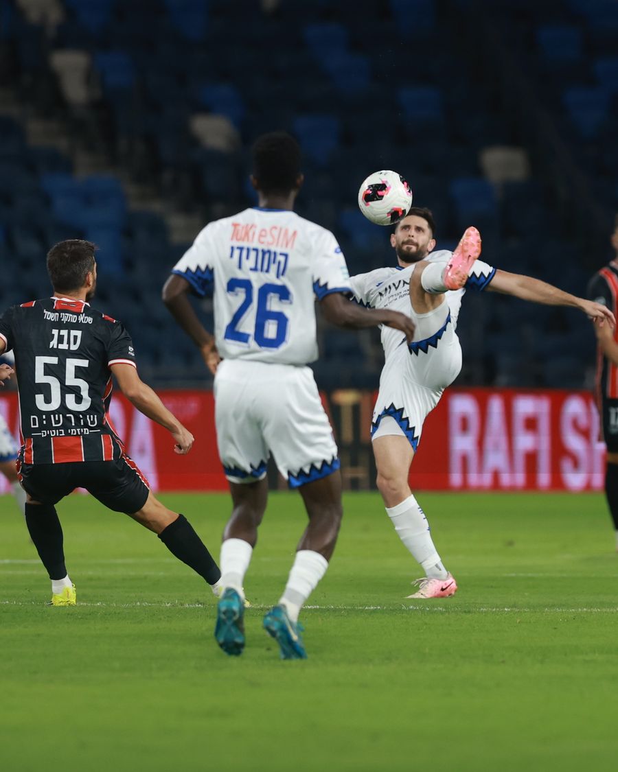 Tomer Altman (Hapoel Petah Tikva) strikes the ball with his right foot