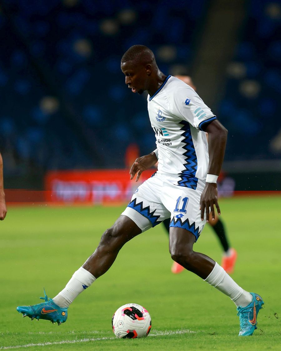 Hamidou Keyta (#11, Hapoel Petah Tikva) strikes the ball with his right foot